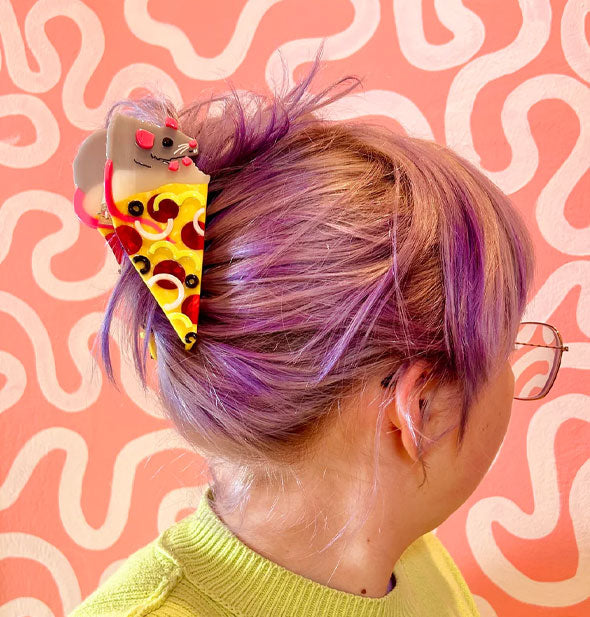 Model wears a Pizza Rat claw clip in a swept-back hairstyle