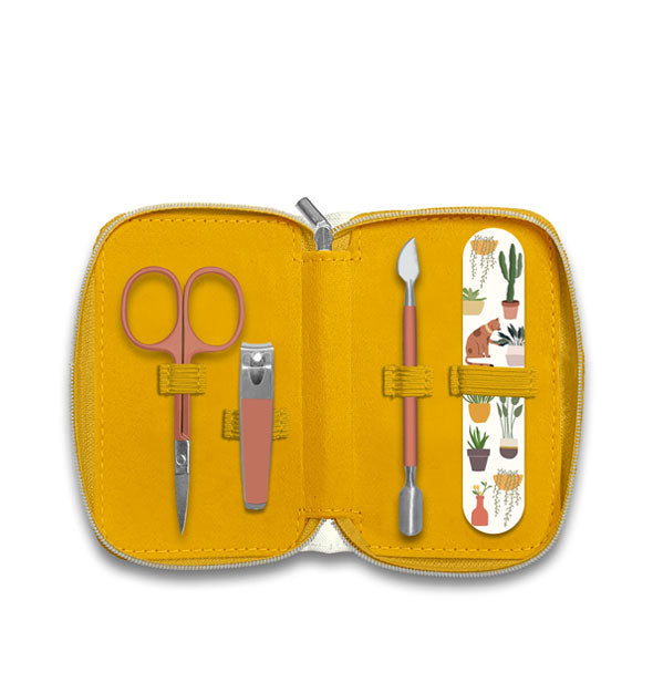 Yellow manicure kit pouch interior with printed emery board and orange-handled cuticle pusher, nail clipper, and nail scissor all secured by elastic bands