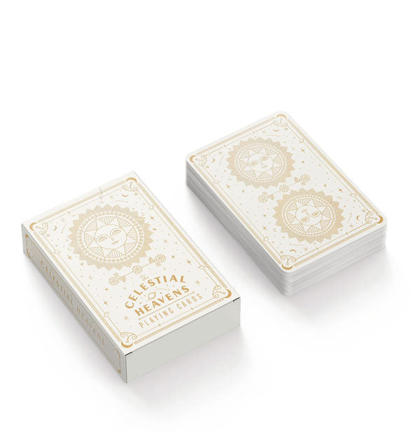 Deck of decorative playing cards and box with celestial sun motif