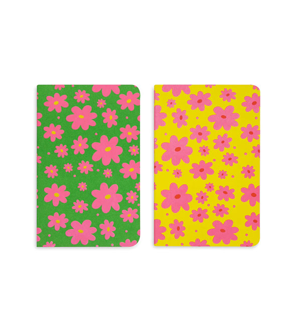 One green and one yellow notebook, each with print of pink daisies