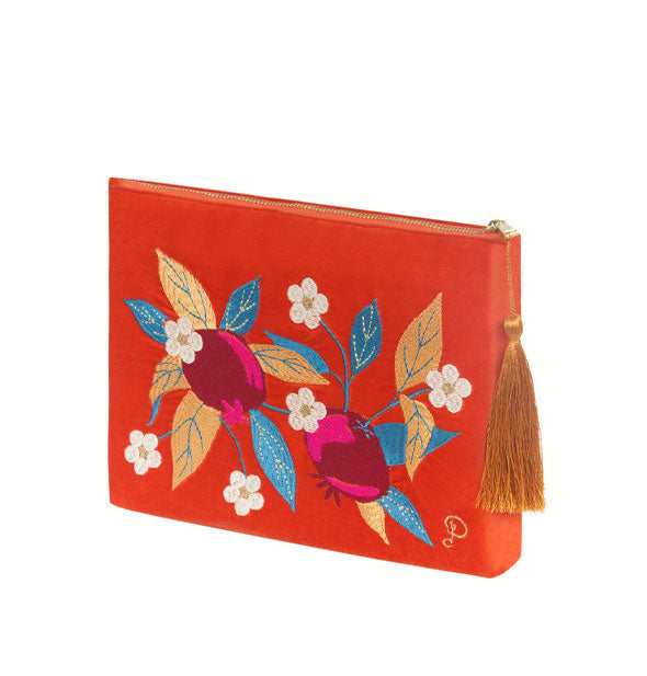 Rectangular red-orange velvet pouch features colorful pomegranates, leaves, and flowers design and has an orange tassel zipper pull