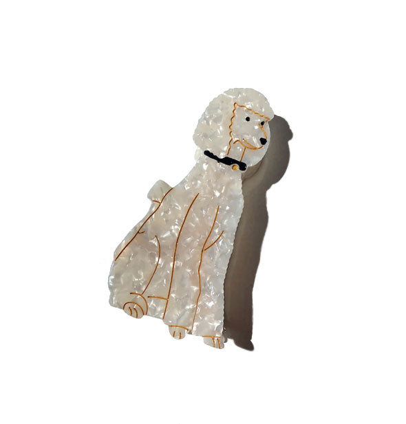 White quartz-effect poodle hair clip with black collar and gold facial and body line detailing