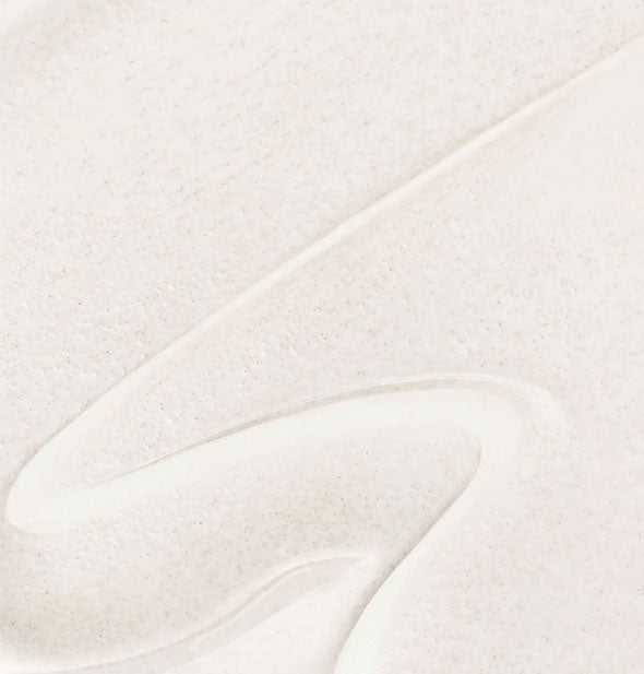 Closeup of Dermalogica Porescreen sunscreen with an S-shaped streak drawn through it