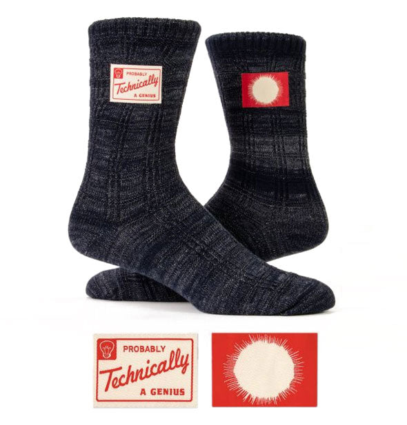 Pair of dark gray socks with decorative labels, one of which says, "Probably Technically a Genius"