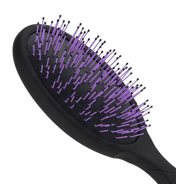 Closeup of Pro Thick Hair Detangler paddle's purple bristles