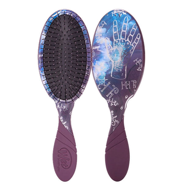 Front and back of a purple and blue Wet Brush with a pattern of astrological and palmistry symbols