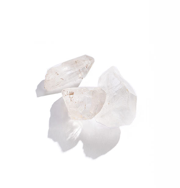 Grouping of three clear crystal quartz stones