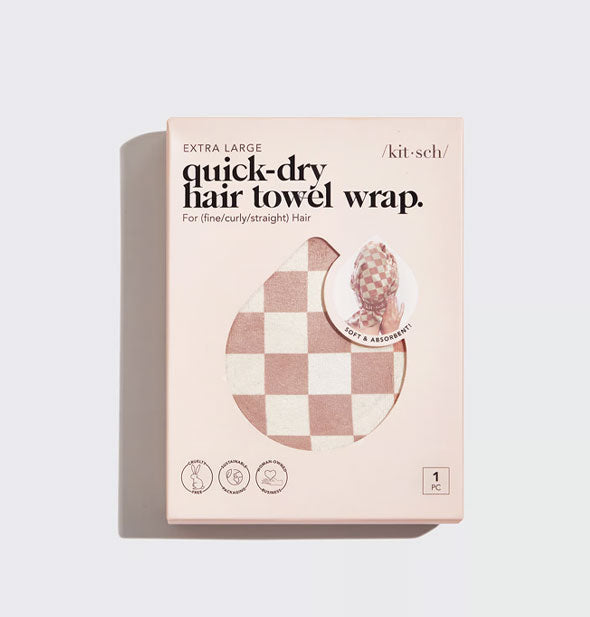 Muted terracotta and white checker print Extra Large Quick-Dry Hair Towel Wrap by Kitsch can be partially seen through a teardrop-shaped window in packaging