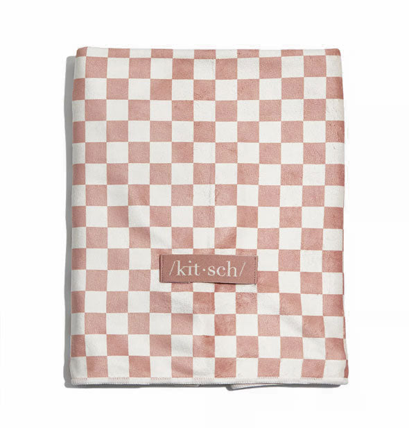 Muted terracotta and white checker print hair towel with sewn-on Kitsch label