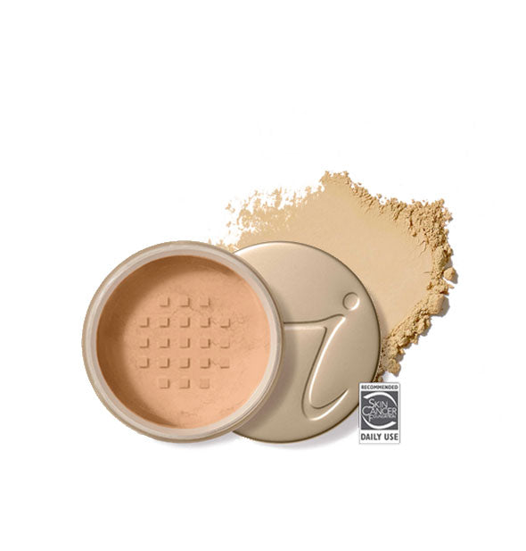 Opened round Jane Iredale loose powder compact with stamped gold lid and product application behind it in shade Radiant