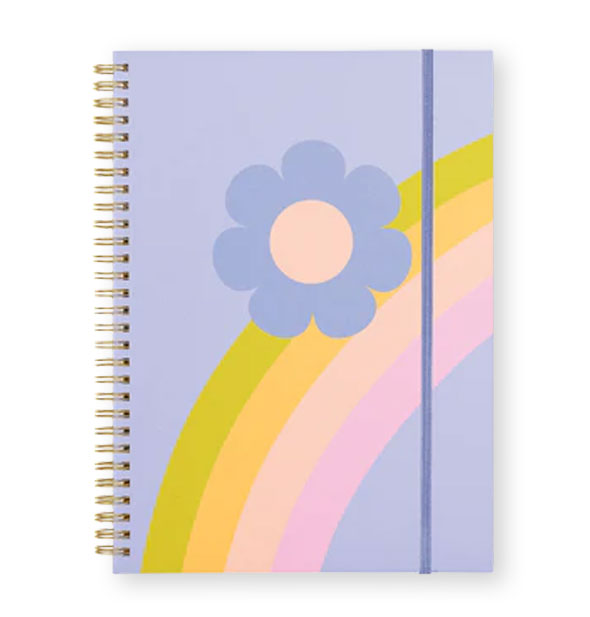 Spiral-bound periwinkle notebook cover with matching elastic band and rainbow + daisy graphic
