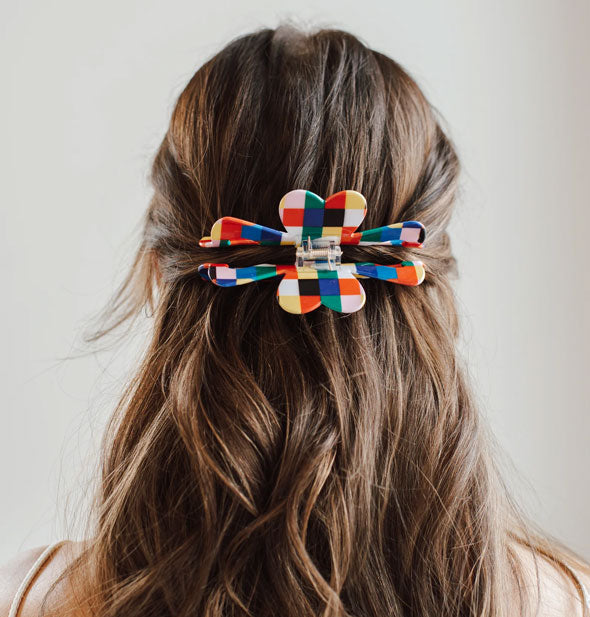 Multicolored checker print hair claw clip in model's hair