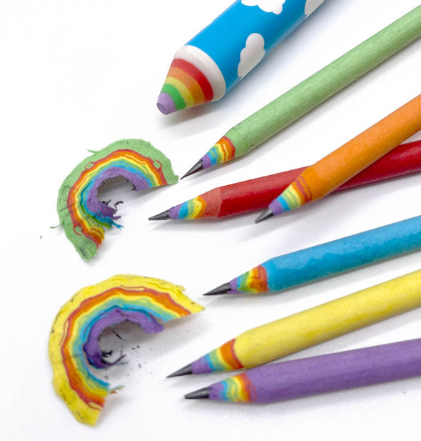 Colorful pencils with rainbow shavings and blue sky eraser