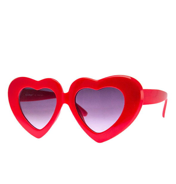 Red heart-shaped sunglasses with thick frame and purple lenses