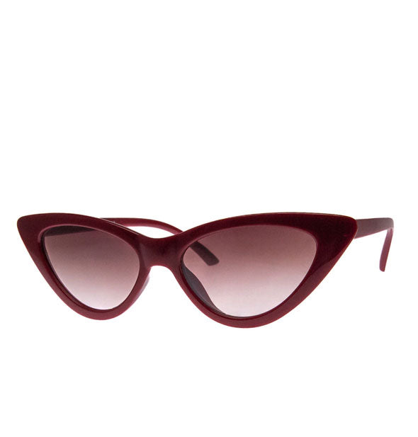 Pair of dark red cat eye sunglasses with reddish-brown lenses