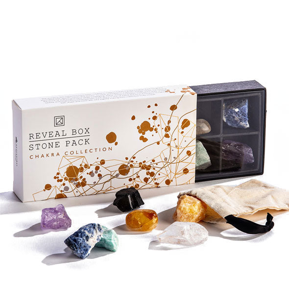 Reveal Box Stone Pack Chakra Collection with crystals spread out in the foreground