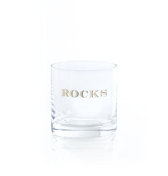 Clear bar glass says, "Rocks" in gold lettering