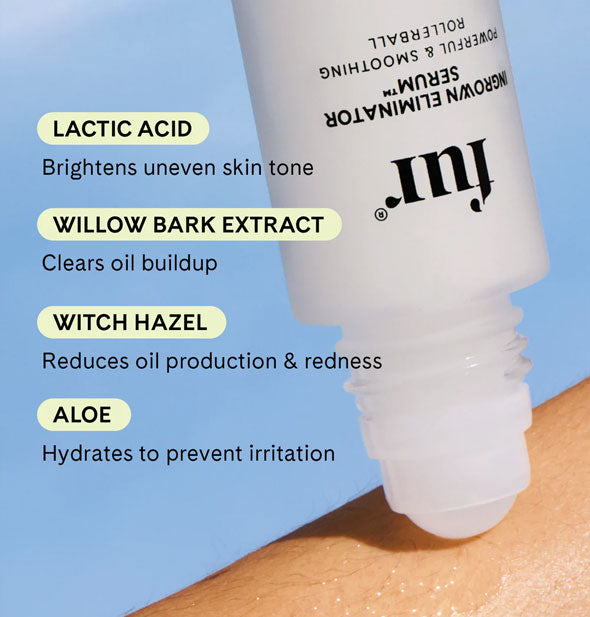 Image of a bottle of Fur Ingrown Eliminator Serum rollerball applied to skin is labeled with the formula's key ingredients: lactic acid, willow bark extract, witch hazel, and aloe