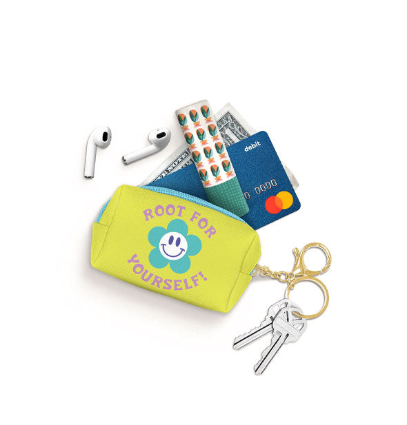 Root for Yourself mini keychain pouch spills out its contents: earbuds, lip balm, credit card, and dollar bill
