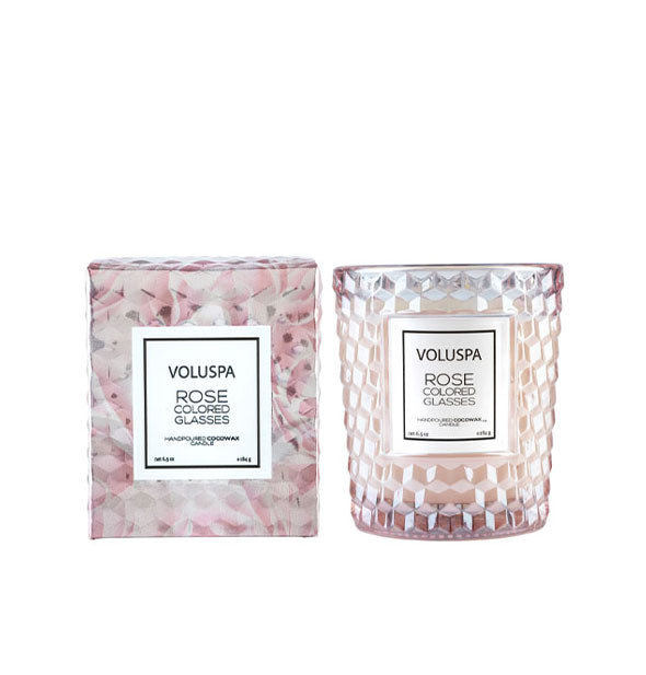 Light pink textured glass Voluspa Rose Colored Glasses candle jar next to pastel pink gift box with rose pattern