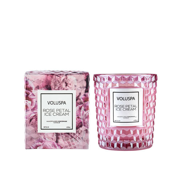 Textured pink Voluspa Rose Petal Ice Cream candle jar next to decorative gift box with pink rose pattern