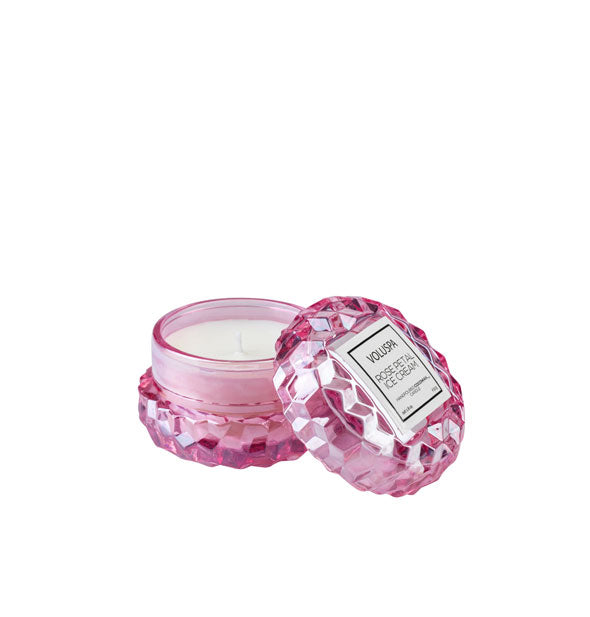 Mini purple-pink textured Voluspa Rose Petal Ice Cream Candle Jar with matching lid removed and propped alongside