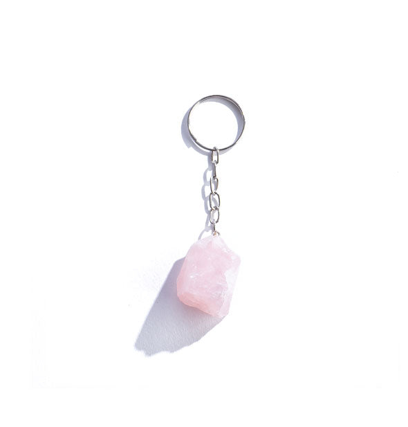 Rough pink roze quartz gemstone on silver keychain hardwre