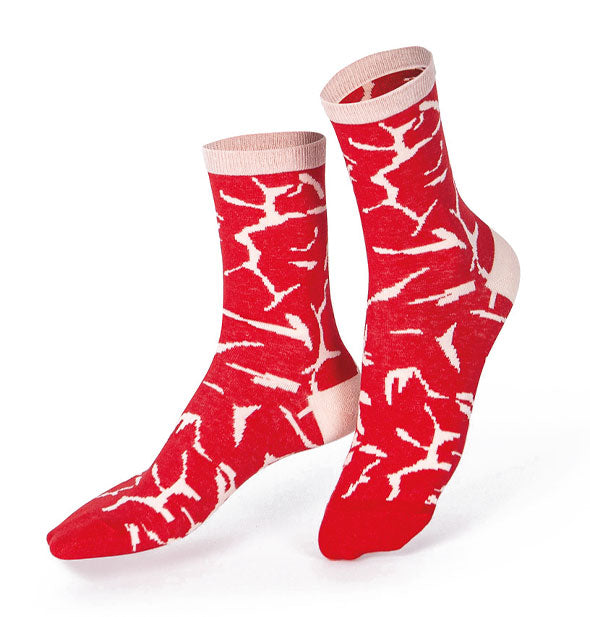 Red crew socks that resemble raw meat with marbled white fat patterning and white ankle bands and heels
