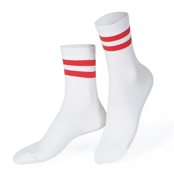 Pair of white crew socks with double red bands near the top openings