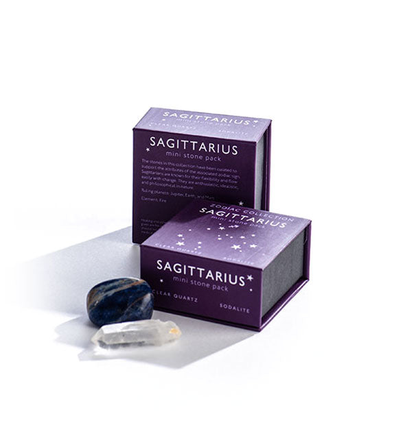 Two dark purple Sagittarius Mini Stone Packs with crystals displayed in front