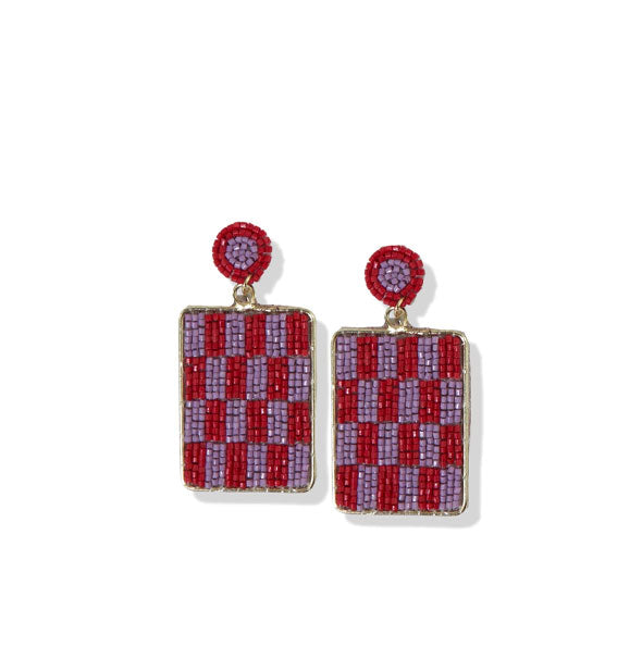 Pair of red and purple beaded earrings with circles at top and rectangular dangles with checkered pattern encased in brass hardware