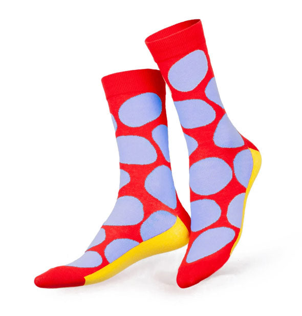 Red socks with large purple polka dots and yellow bottoms