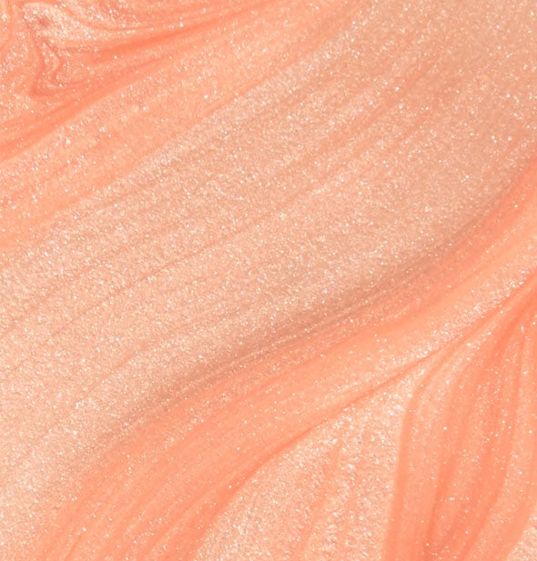 Closeup of shimmery orange nail polish
