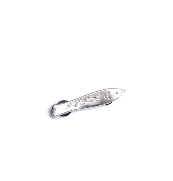 Slender silver sardine pin with engraved details