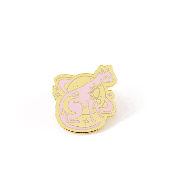 Pink and gold enamel pin is designed with a sitting cat in front of Saturn along with stars and other celestial symbols