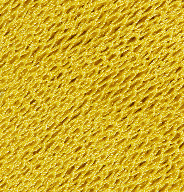 Closeup of the yellow textured nylon fabric of the Fur Scrub Sheet