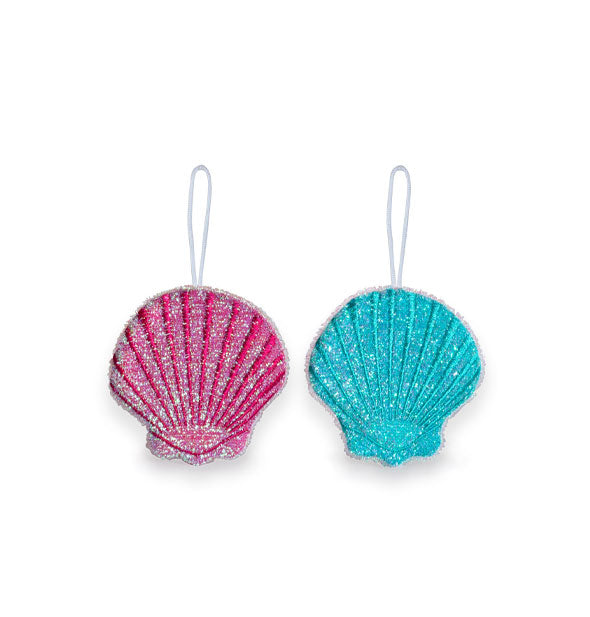 Pair of sparkly scallop seashell dish sponges, one pink and one blue, each with a white hanging loop at top