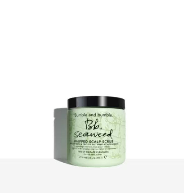 Green 6.7 ounce tub of Bumble and bumble Seaweed Whipped Scalp Scrub with black cap and lettering
