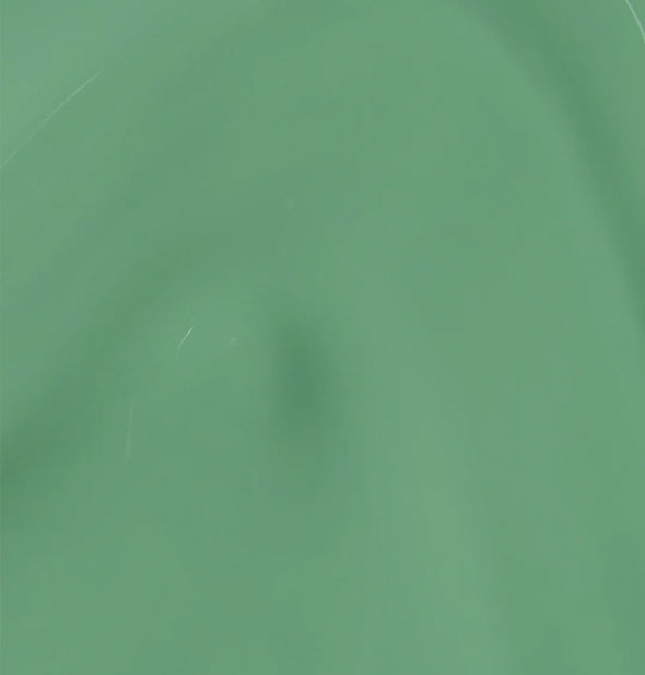 Closeup of medium green creme nail polish