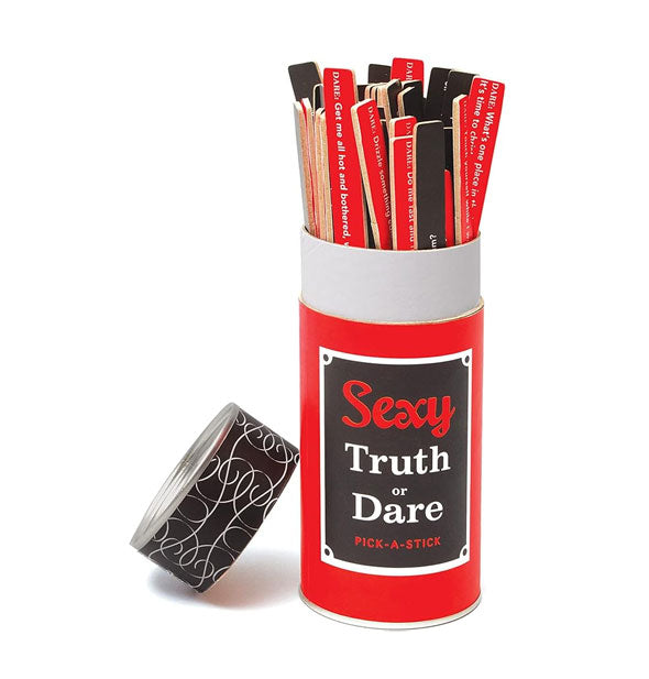 Red, black, and white tube of Sexy Truth or Dare Pick-a-Sticks with lid removed and resting against