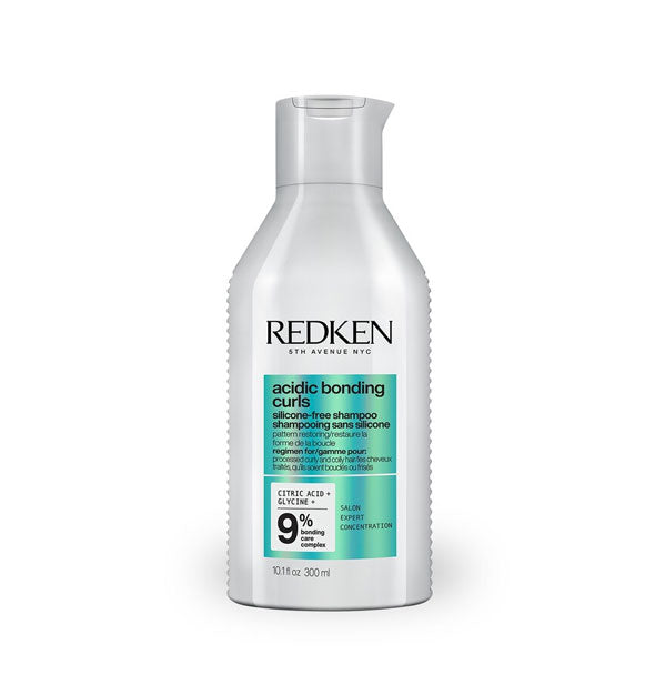 Silvery-white 10.1 ounce bottle of Redken Acidic Bonding Curls Silicone-Free Shampoo with metallic teal color block and black lettering