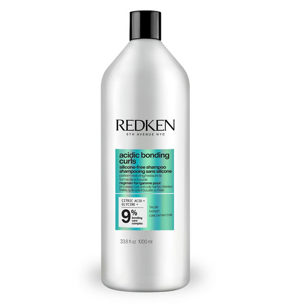 Silvery-white 33.8 ounce bottle of Redken Acidic Bonding Curls Silicone-Free Shampoo with metallic teal color block and black lettering