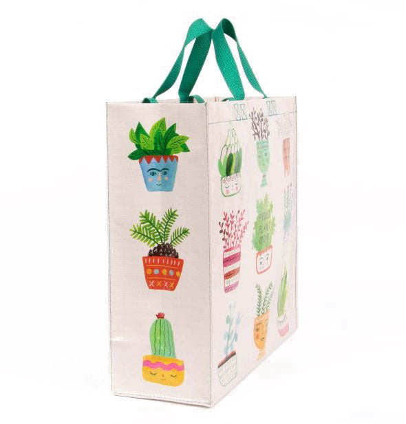 Three-quarter view of shopping bag with all-over potted plant illustrations