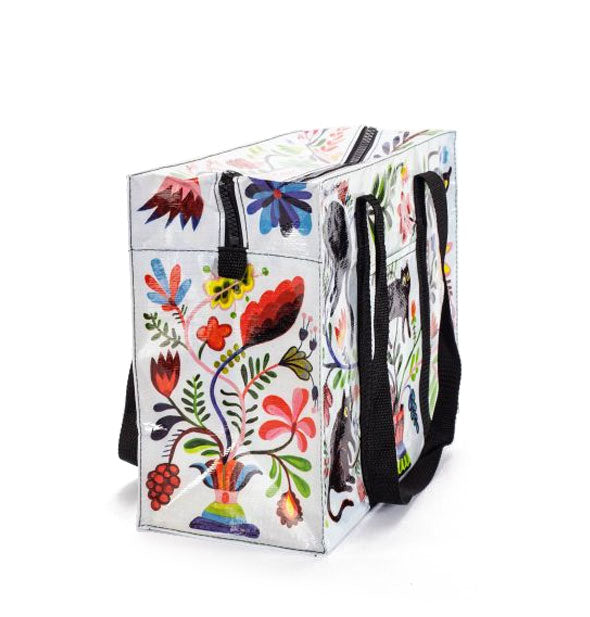 Side panel of shoulder bag features colorful florals and vines design