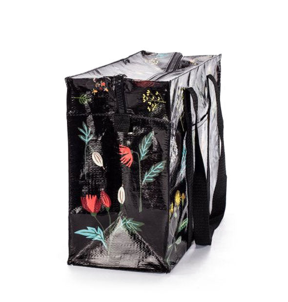 Side panel of shoulder bag with floral design detail