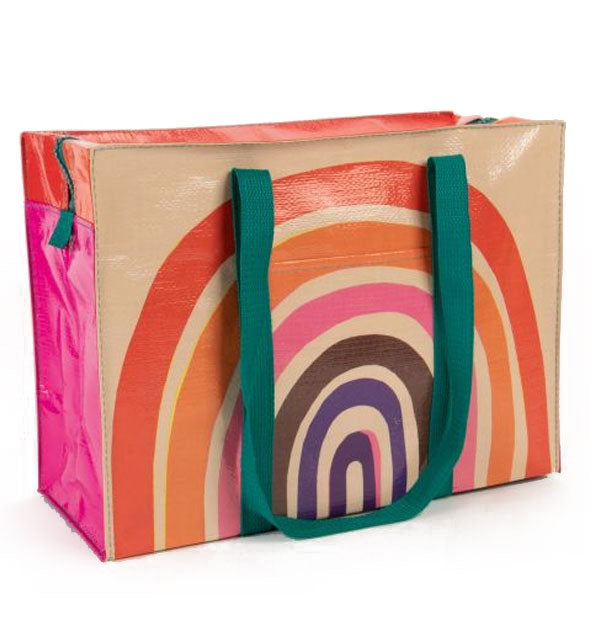 Rectangular beige bag with colorful rainbow design, pink and red side panels, green top zipper, and green shoulder strap