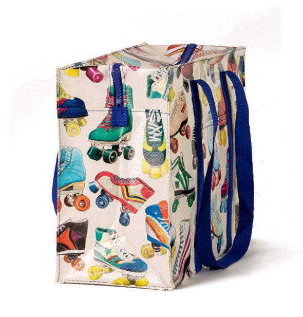 White rectangular tote bag with royal blue strap and zipper, and colorful all-over roller skate illustrations