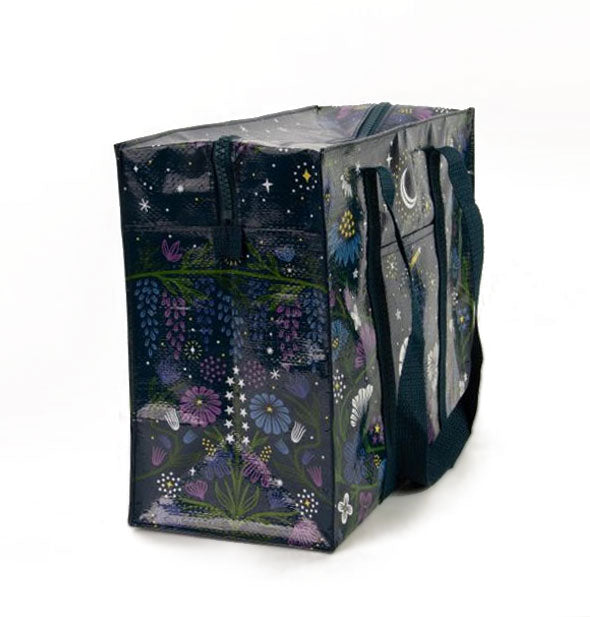 Rectangular shoulder bag features all-over flowers, moon, and stars illustrations
