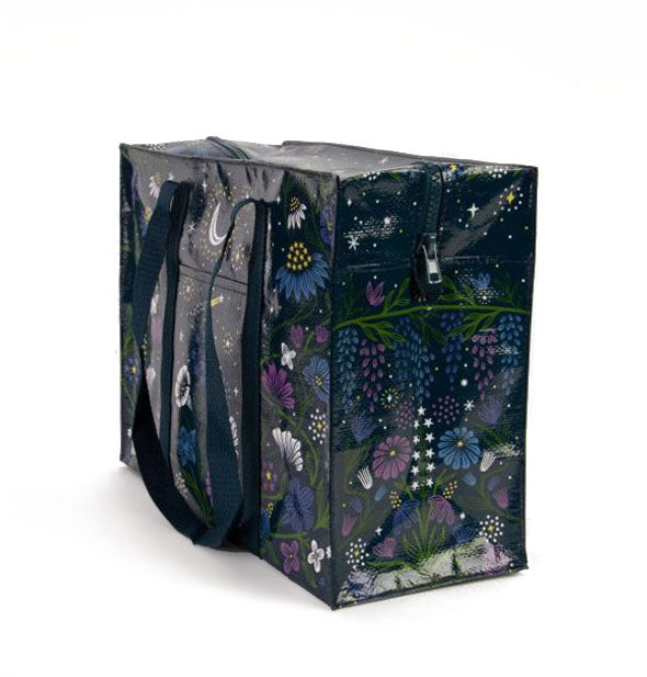 Rectangular shoulder bag features all-over flowers, moon, and stars illustrations