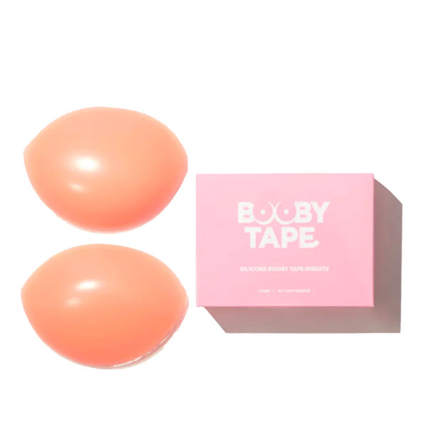 Fleshy-colored Booby Tape Silicone Inserts next to pink and white box packaging